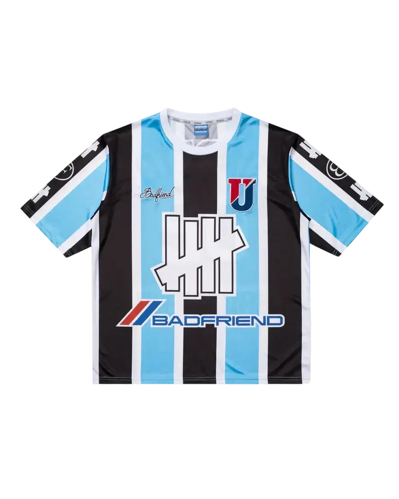 Black and light blue striped soccer jersey with white trim featuring bold badfriend logo by undefeated x badfriend