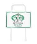 Undercover women’s white tote bag with green border and meditating figure graphic for yoga use