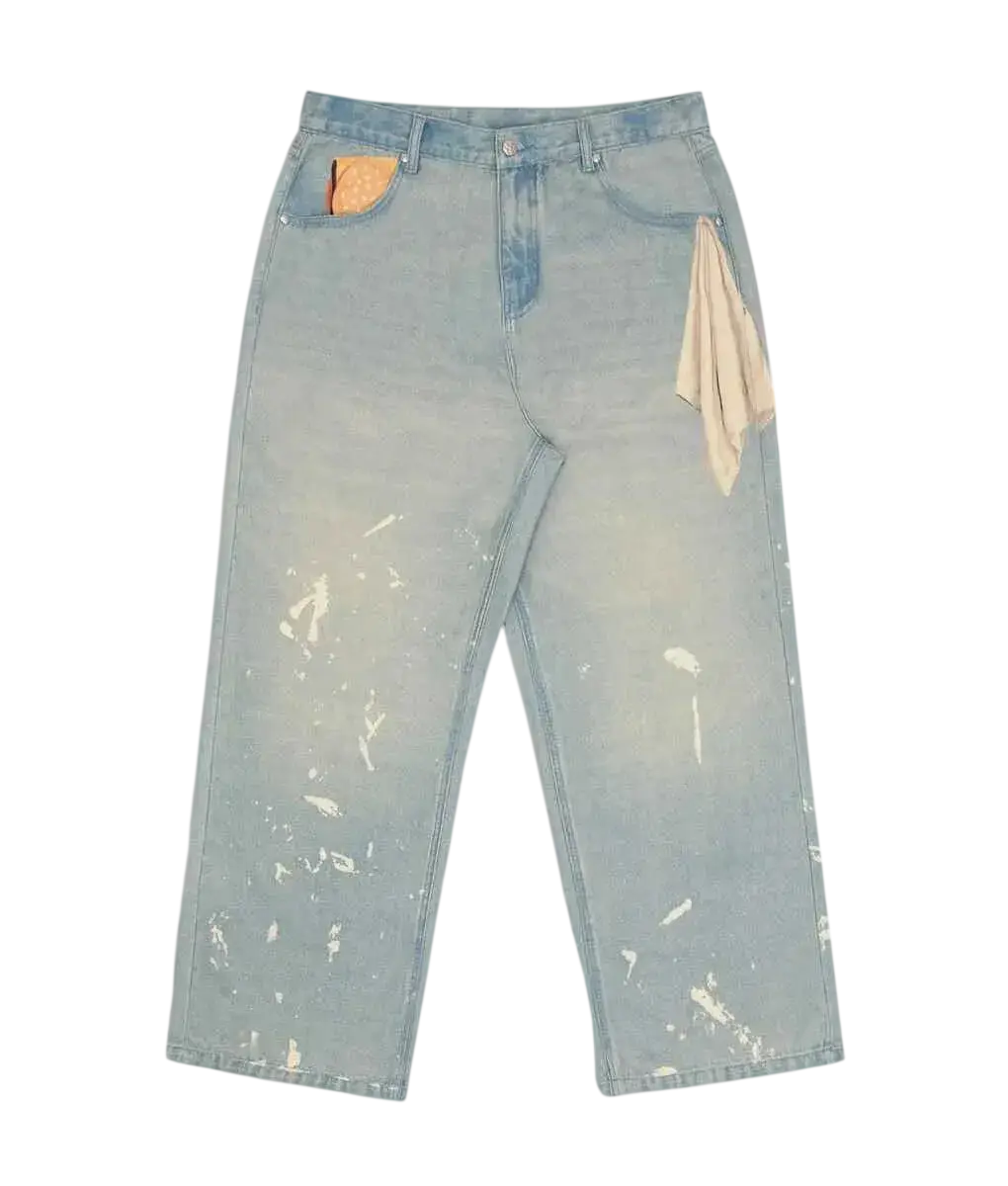 Vandy the Pink Fries Trompe Loeil denim light-wash distressed jeans with paint splatter and orange beige pocket accents