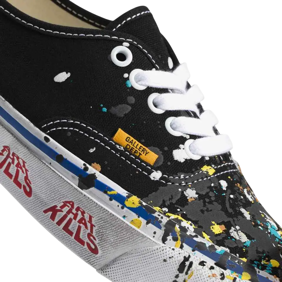 Black canvas Vans Authentic Reissue 44 sneaker with white laces and yellow blue teal paint splatter featuring gallery dept label