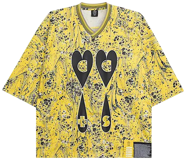 Yellow short-sleeved v-neck hockey jersey with marbled black and white pattern and bold black heart graphics by Vans OTW x Sterling Ruby