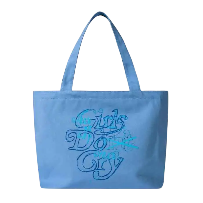 Light blue canvas tote bag with embroidered girls dont cry text from Verdy x Dover Street Market with Verdy keychain