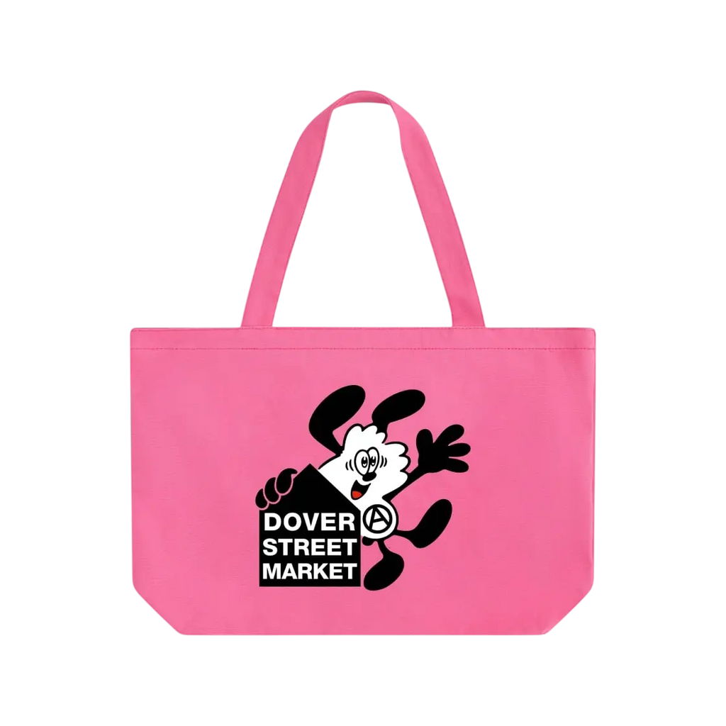 A vibrant pink canvas tote bag with a black and white cartoon character and dover street market logo with verdy keychain
