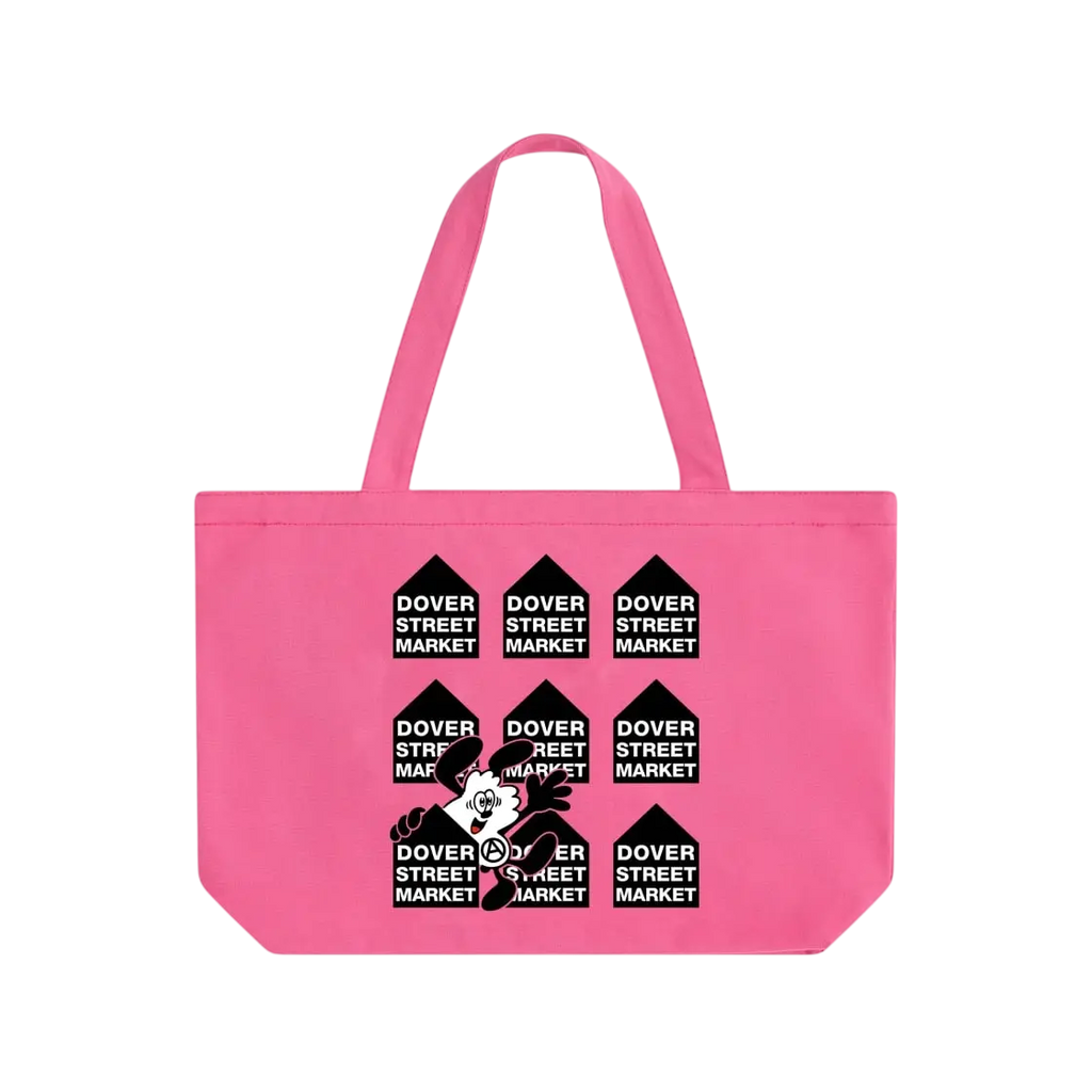 Bright pink canvas tote bag with repeating black dover street market logos and a central verdy cartoon character