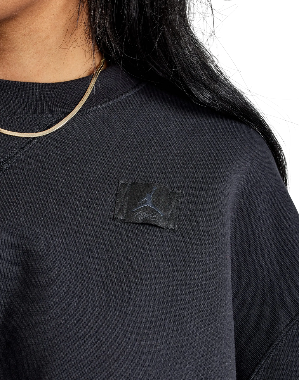 Women’s jordan fleece cropped sweatshirt black with subtle textured fabric and matching black jumpman patch
