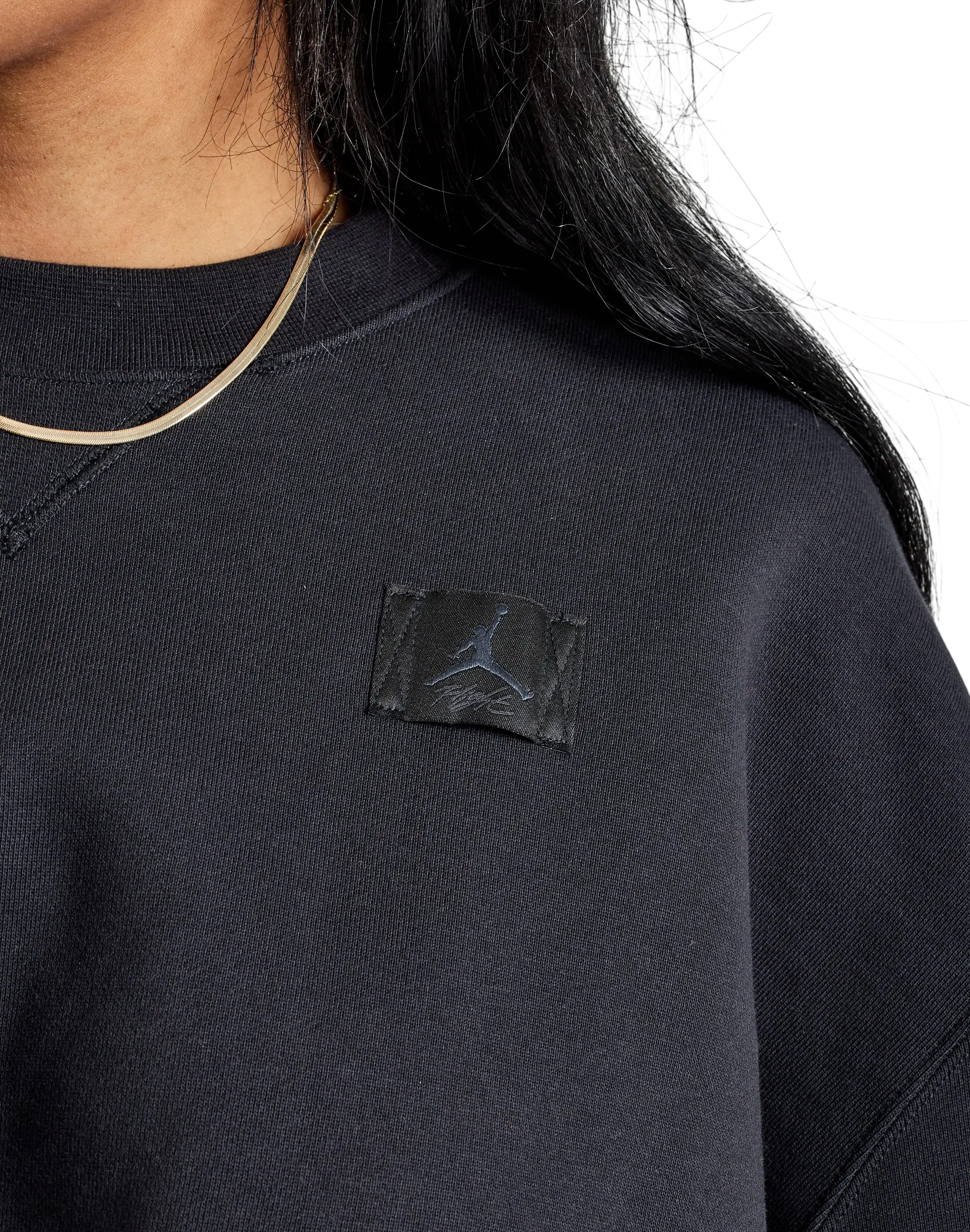Women’s jordan fleece cropped sweatshirt black with subtle textured fabric and matching black jumpman patch