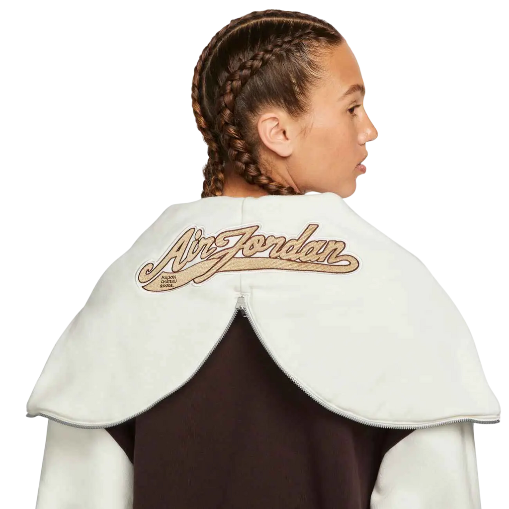White air jordan cape with tan embroidered logo and zipper closure for women’s maison chateau rouge x jordan pullover hoodie