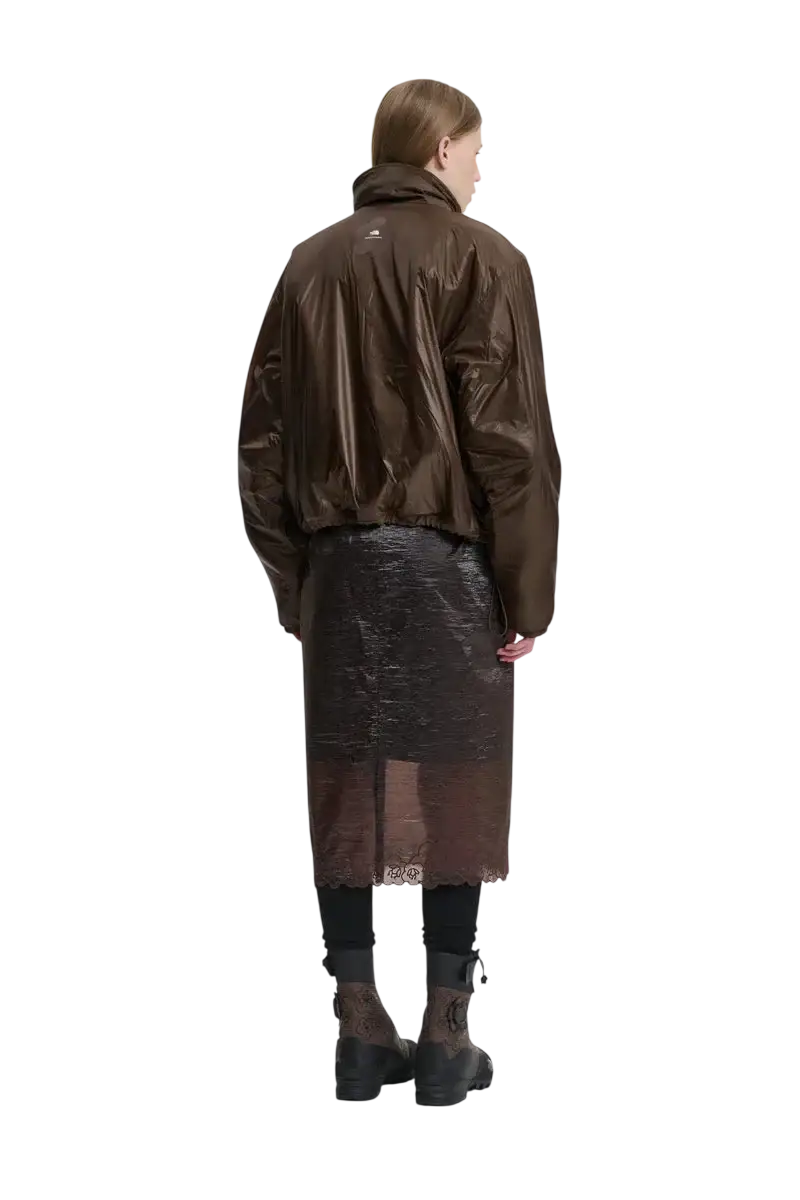 Brown glossy faux leather bomber jacket with high collar and subtle branding on back from the north face x cecile bahnsen